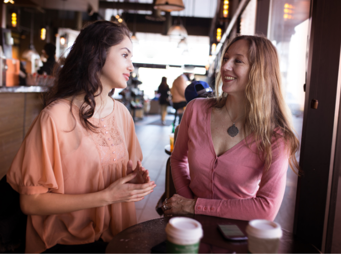Mom having a positive talk with with teen daughter with ADHD at coffeeshop