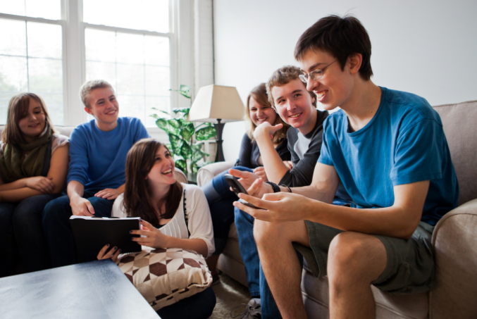 teens laughing in living room verbal communication