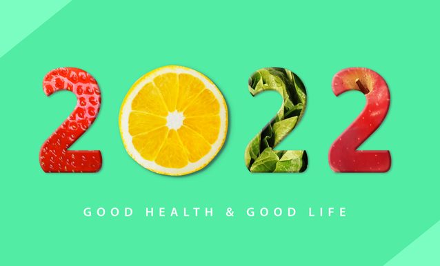 The year 2022 written in fruits, in front of a green background, and text that says "good health and good life."
