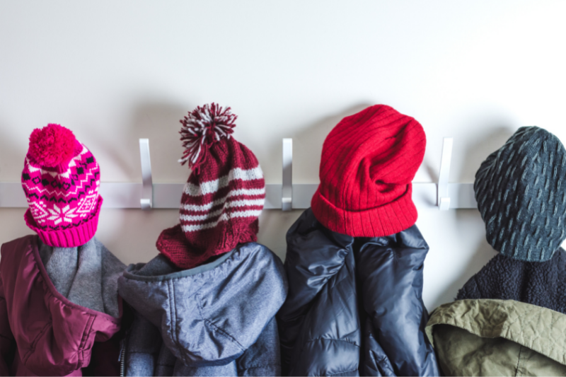 Jackets and hats organized in home entry way for smooth mornings