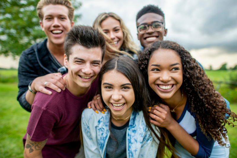 group of smiling teens