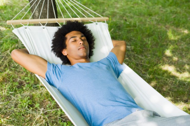 man sleeping in hammock