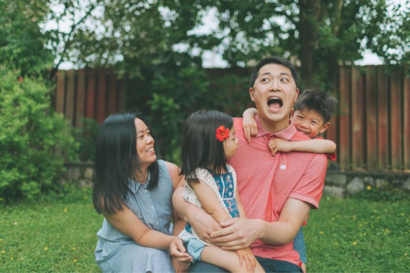 Asian family having fun in stressful situation