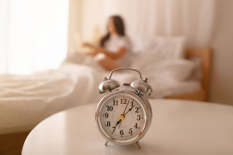 Woman with alarm clock