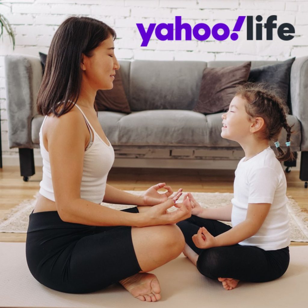 Mom and child doing yoga