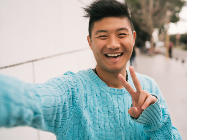 young man smiling in self-acceptance