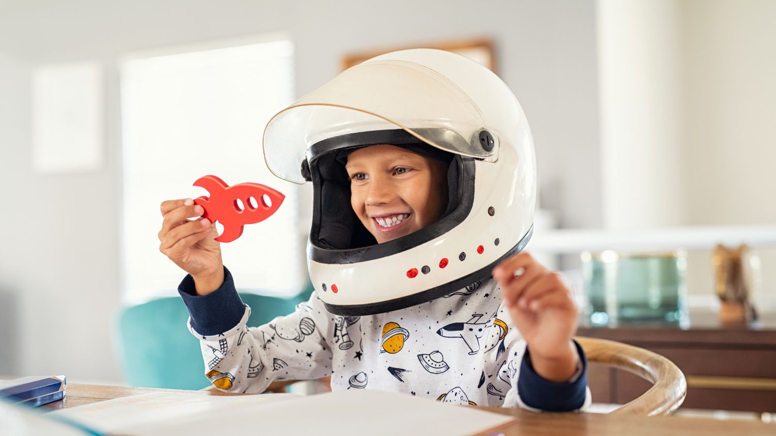 Boy with astronaut helmet on