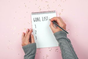 goal list written on notepad