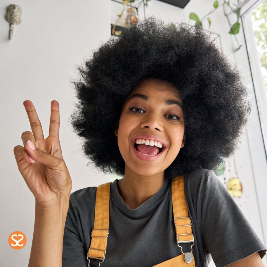 Beautiful brown teen with a peace sign