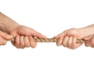 Man and woman pulling a rope